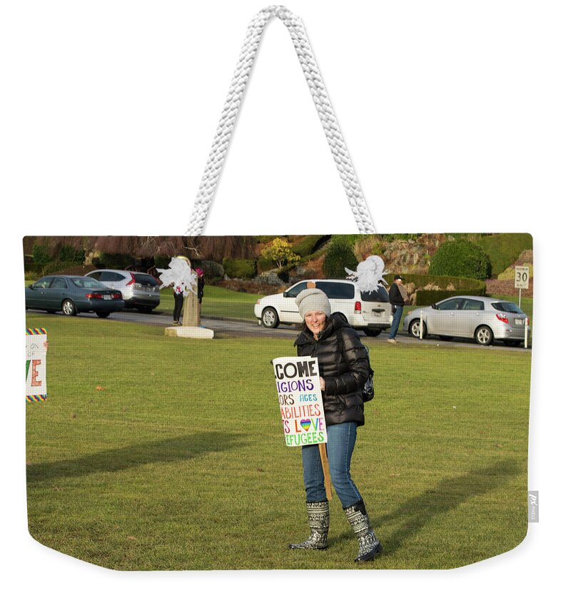 Sign Weekender Tote Bag featuring the photograph Parkas and Protest Signs by Tom Cochran