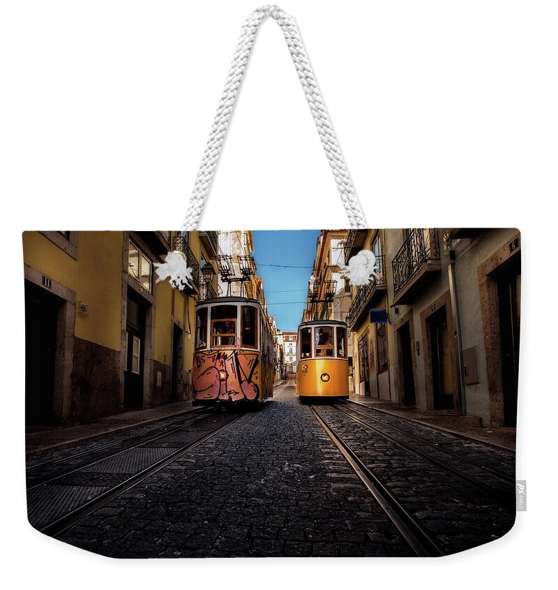 Lisbon Weekender Tote Bag featuring the photograph Passing by by Jorge Maia