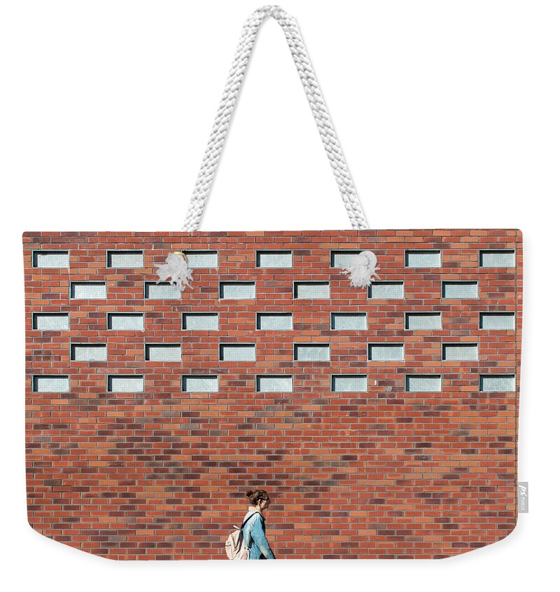 Urban Weekender Tote Bag featuring the photograph Passing By by Stuart Allen