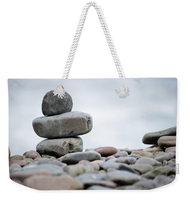 Pebbles Weekender Tote Bag featuring the photograph Pebble Stack by Helen Jackson