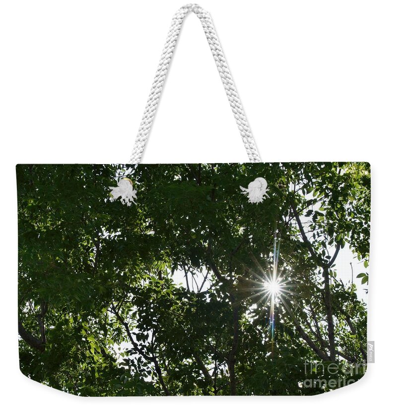 Sun Weekender Tote Bag featuring the photograph Peeking Through by Wibada Photo