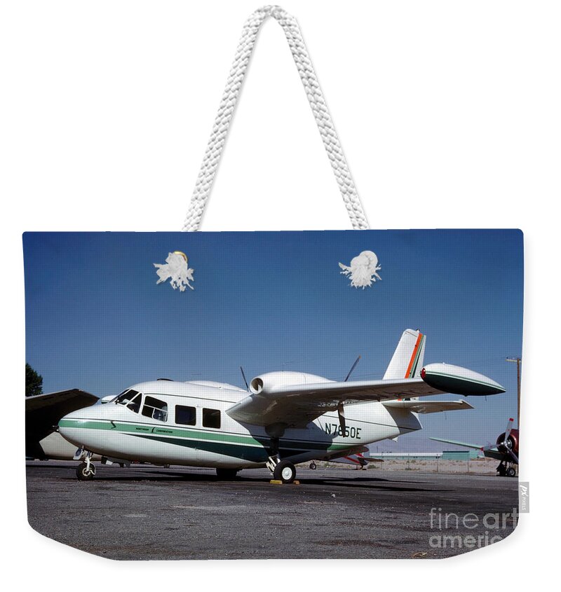 Piaggio P.166 Weekender Tote Bag featuring the photograph Piaggio P.166 on the Tarmac by Wernher Krutein