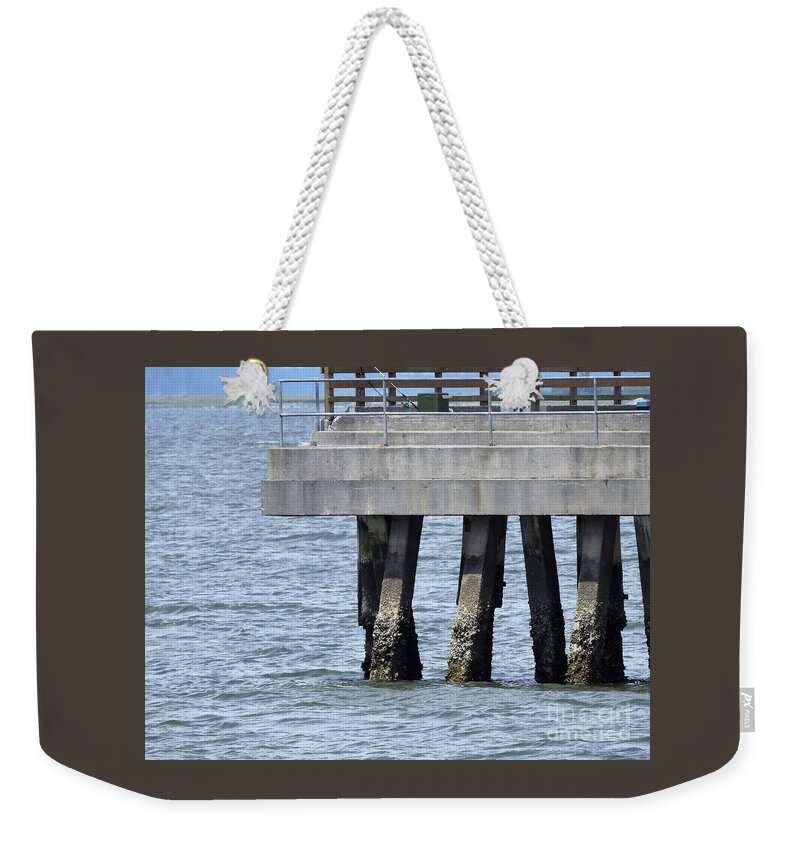 Pier Weekender Tote Bag featuring the photograph Pier At Low Tide by Jan Gelders