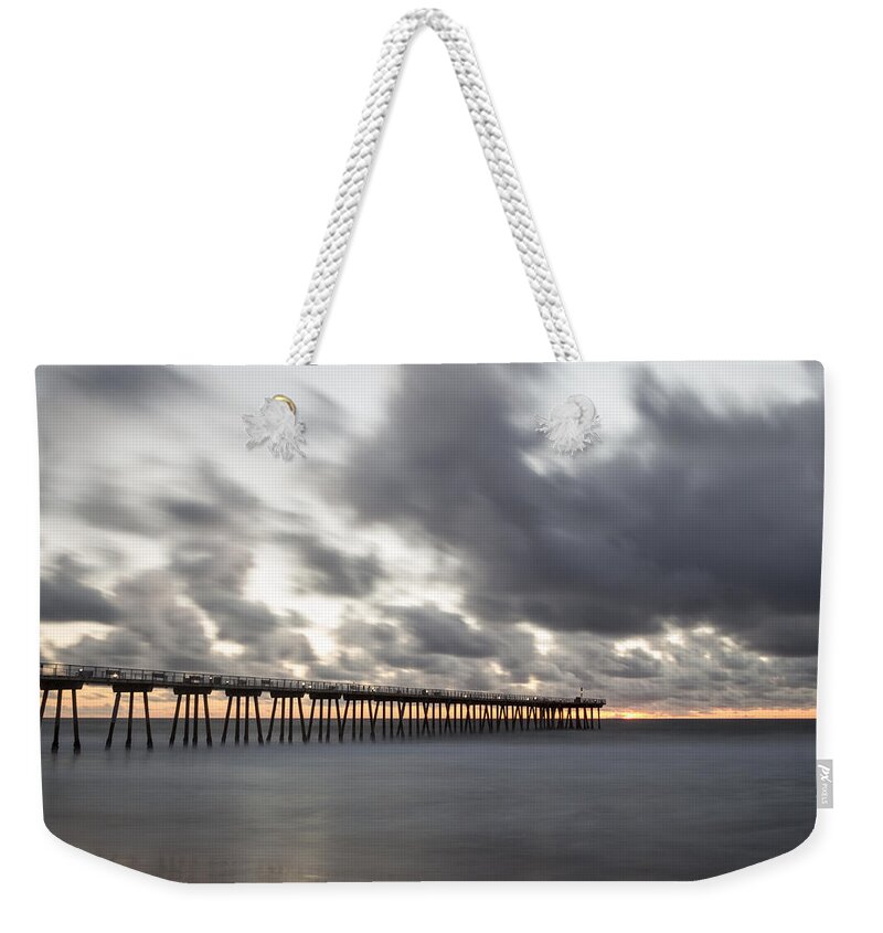Shore Weekender Tote Bag featuring the photograph Pier in Misty Waters by Ed Clark