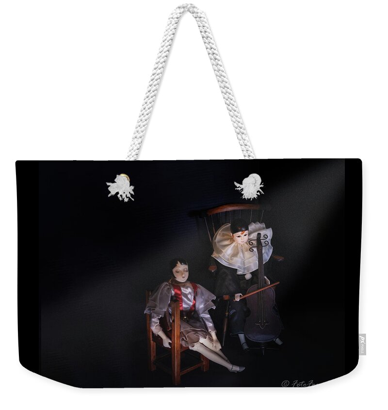 Dark Weekender Tote Bag featuring the photograph Pierrot and Columbine by Alexander Fedin