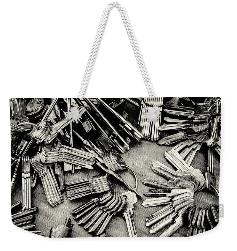 Metal Key Weekender Tote Bag featuring the photograph Piles of Blank Keys in Monochrome by John Williams