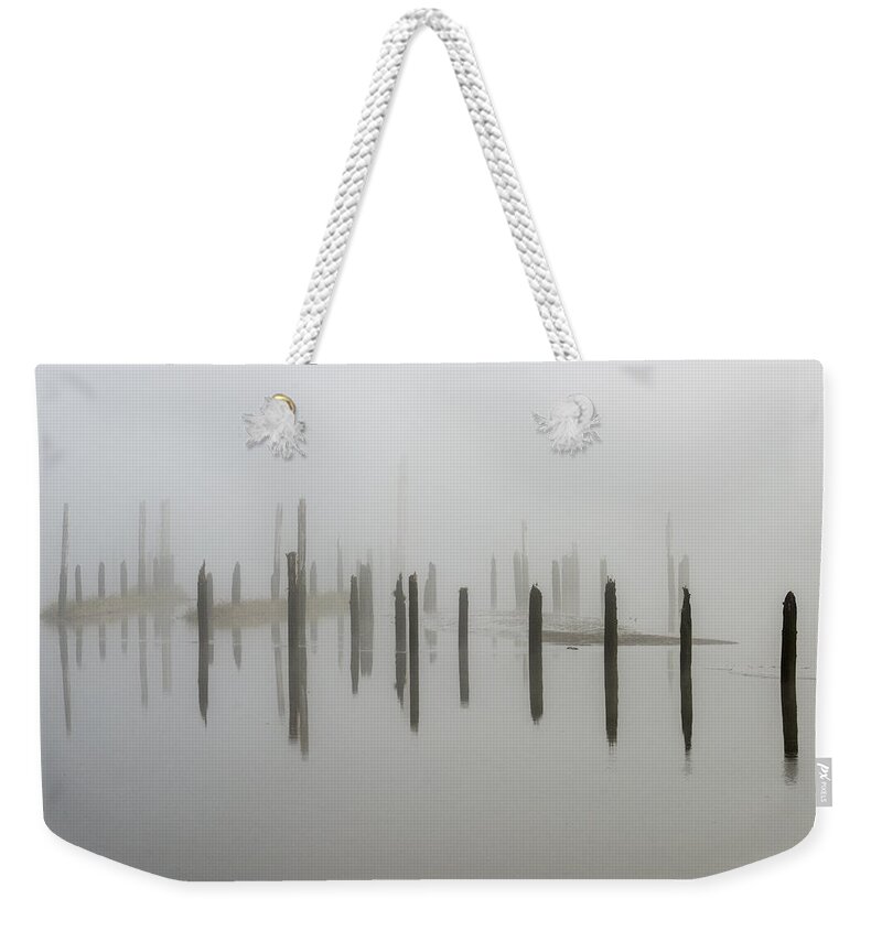 Astoria Weekender Tote Bag featuring the photograph Pilings in the Mist by Robert Potts