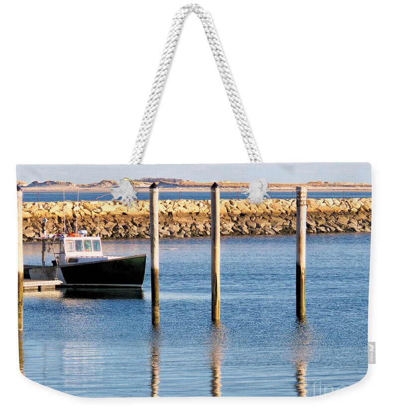 Pilings Weekender Tote Bag featuring the photograph Pilings Reflections by Janice Drew