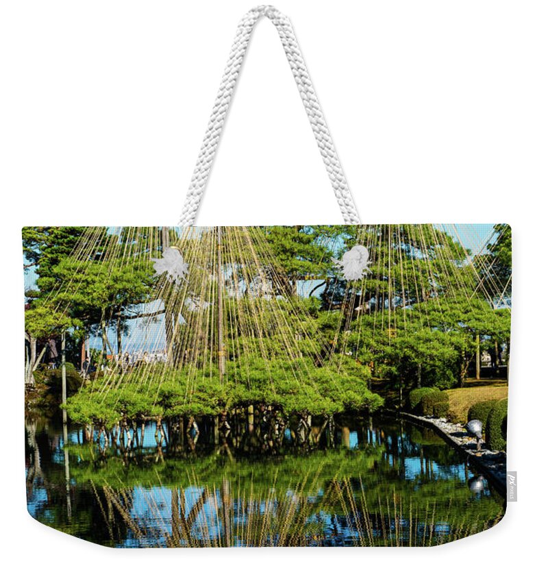 Landscape Weekender Tote Bag featuring the photograph Pine tree protection from Snow by Hisao Mogi