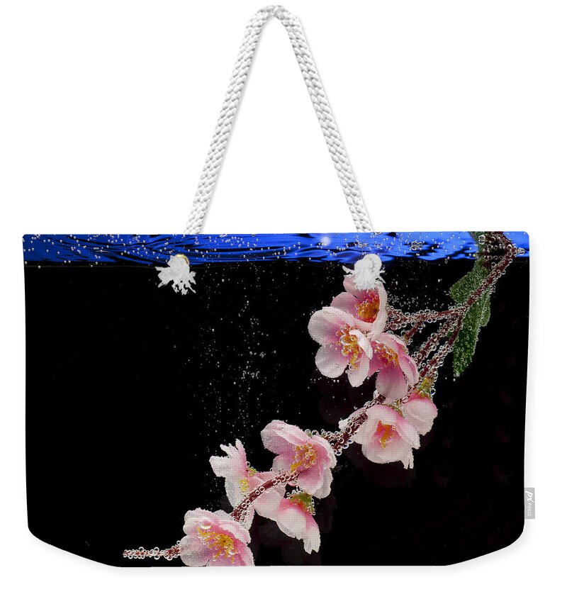 Water Weekender Tote Bag featuring the photograph Pink Blossom in Water with Bubbles by Dmitry Soloviev