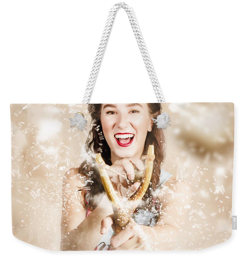 Target Weekender Tote Bag featuring the photograph Pinup woman shooting rocks with toy slingshot by Jorgo Photography