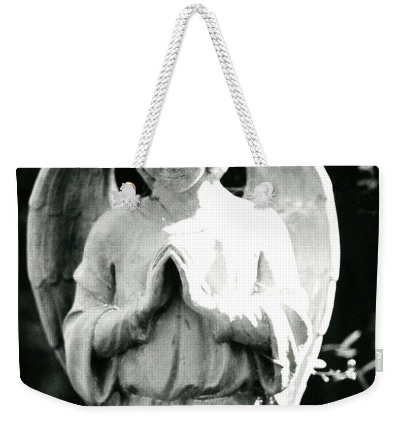 Angel Weekender Tote Bag featuring the photograph Praying Angel Statue in Black and White by John Harmon
