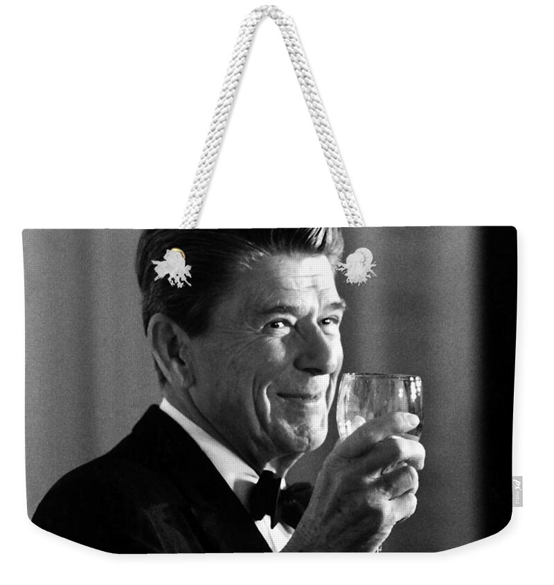 Ronald Reagan Weekender Tote Bag featuring the painting President Reagan Making A Toast by War Is Hell Store