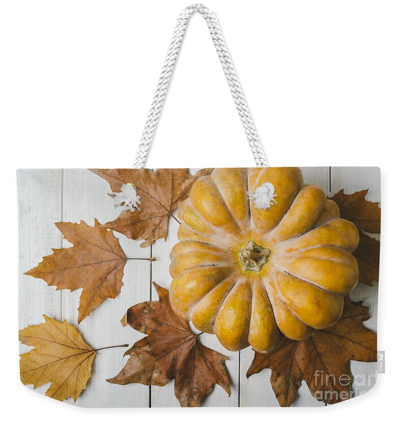 Pumpkin Weekender Tote Bag featuring the photograph Pumkin and maple leaves by Jelena Jovanovic