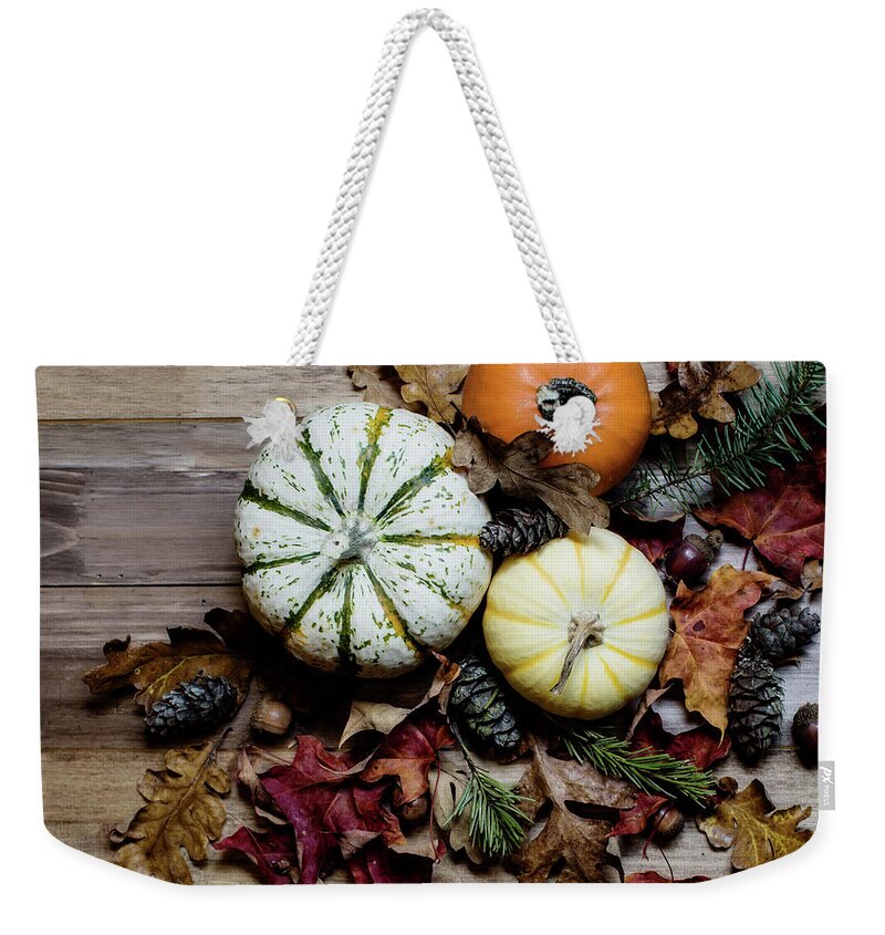 Pumpkins Weekender Tote Bag featuring the photograph Pumpkins and Leaves by Rebecca Cozart