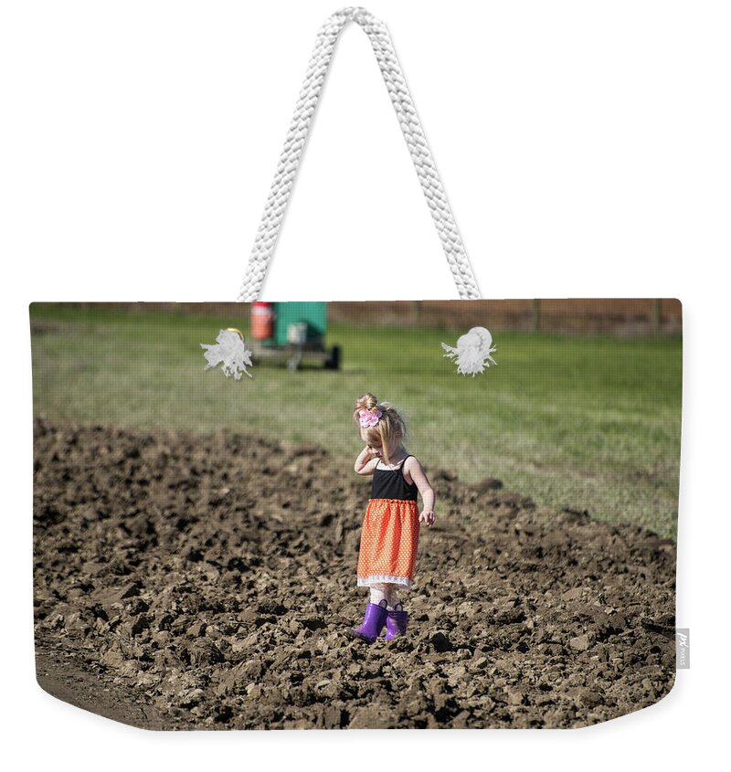 Purple Boots And Mud Clods Weekender Tote Bag featuring the photograph Purple Boots and Mud Clods by Tom Cochran