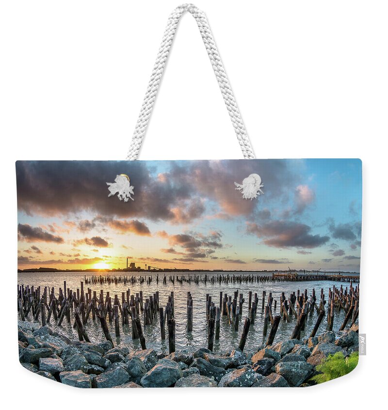 Evening Weekender Tote Bag featuring the photograph Pylons Mill Sunset by Greg Nyquist