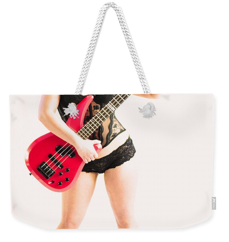 Red Weekender Tote Bag featuring the photograph Red bass guitar by Robert WK Clark