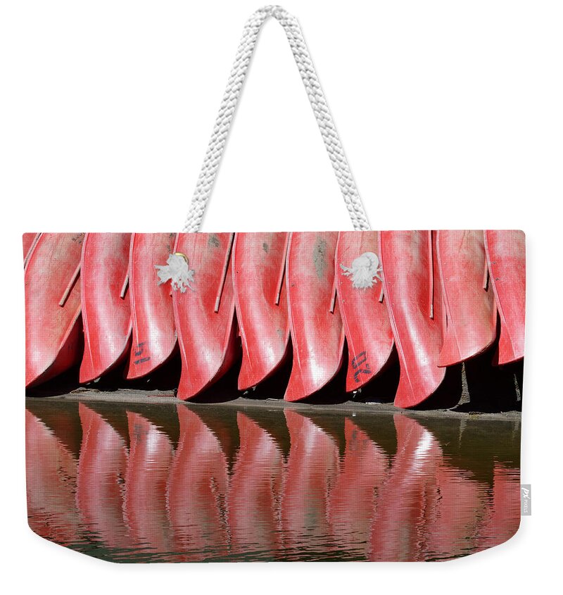 United States Weekender Tote Bag featuring the photograph Red Canoes by Darin Volpe