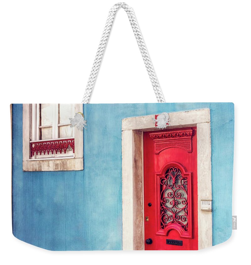 Lisbon Weekender Tote Bag featuring the photograph Red Door in Lisbon by Carol Japp