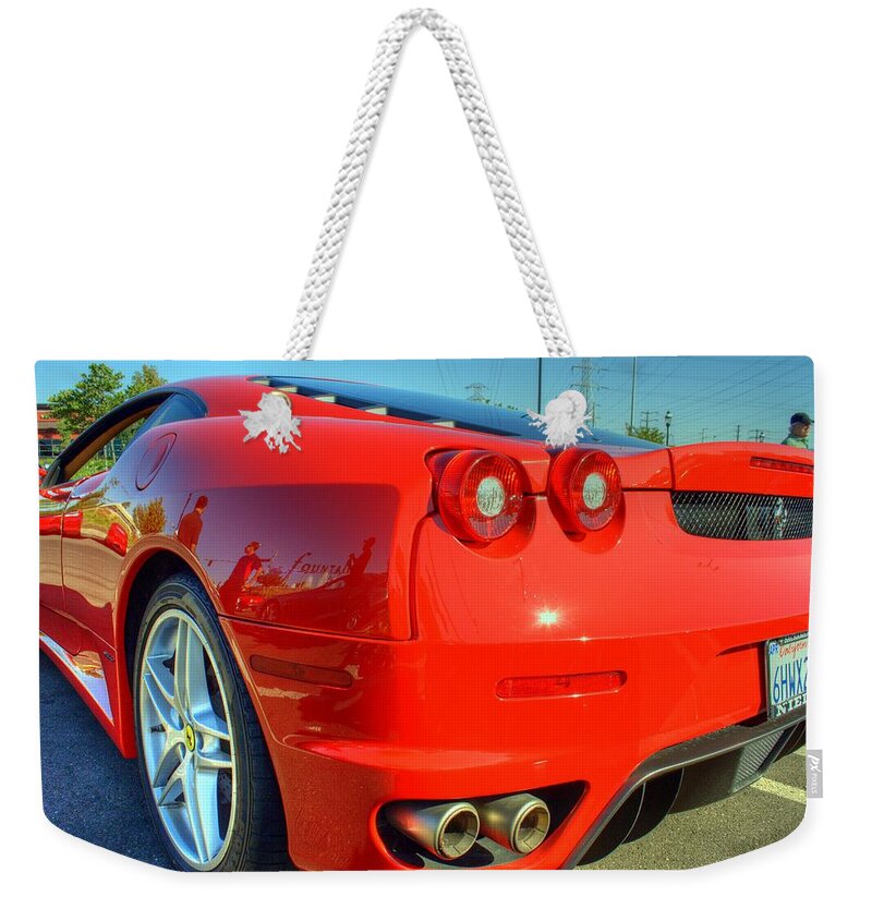 Euro Sunday Weekender Tote Bag featuring the photograph Red Ferrari by Randy Wehner