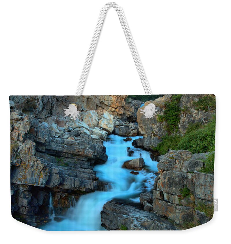 Swiftcurrent Falls Weekender Tote Bag featuring the photograph Red Glow Over Swiftcurrent by Adam Jewell