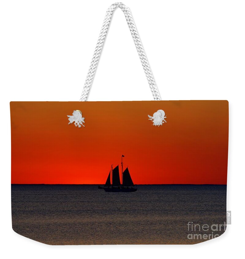 Red Weekender Tote Bag featuring the photograph Red Skies by John Fabina