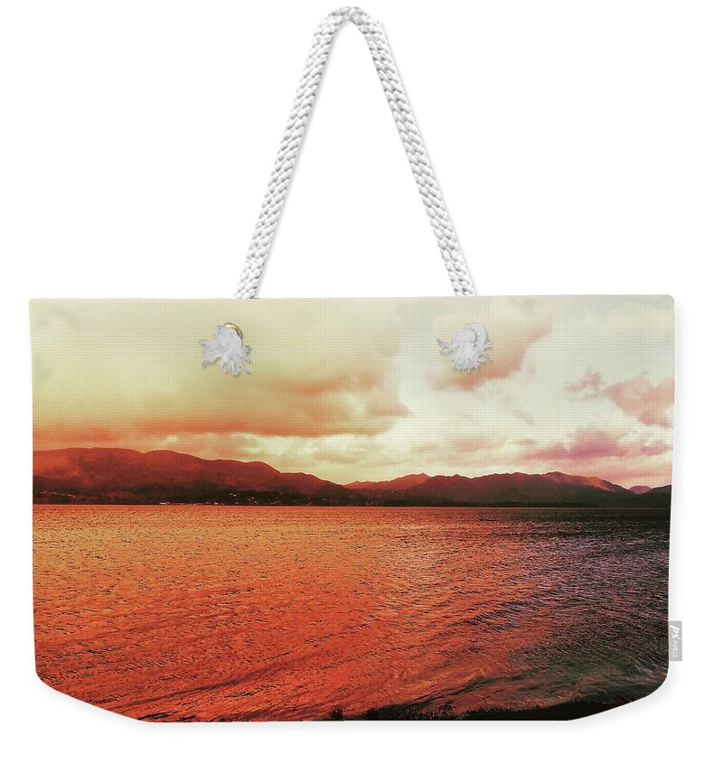 Sunset Weekender Tote Bag featuring the photograph Red Sky After Storms by Chriss Pagani