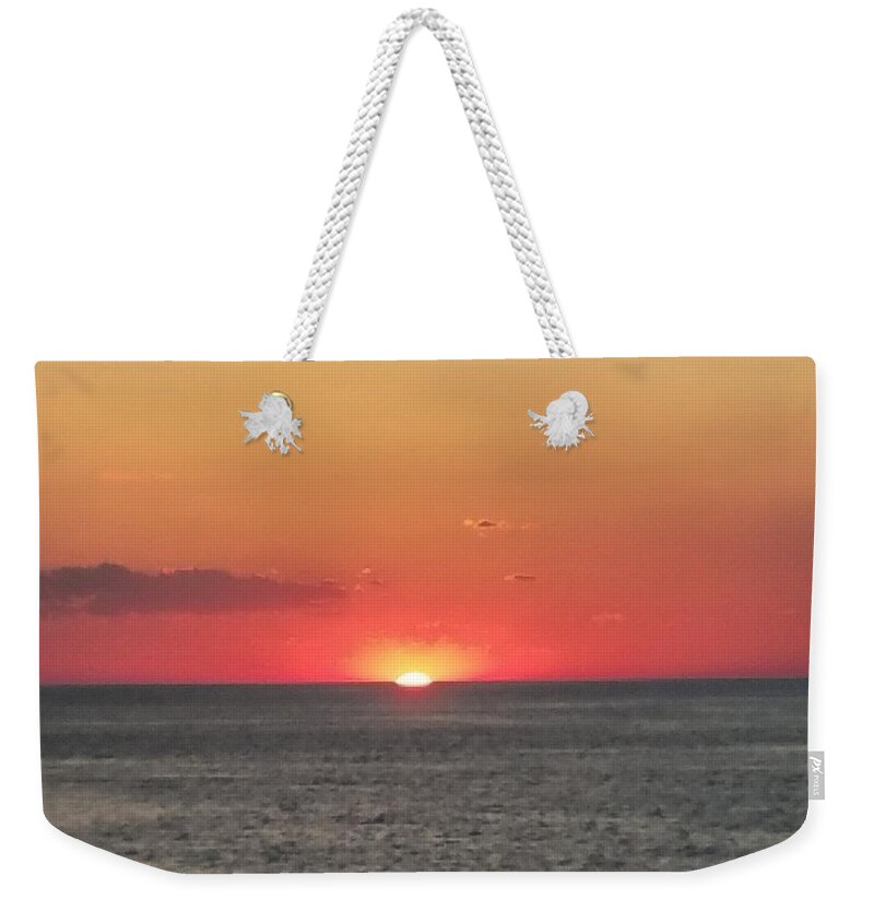 Sunset Weekender Tote Bag featuring the photograph Red Sun Sets Over Ocean by Vic Ritchey