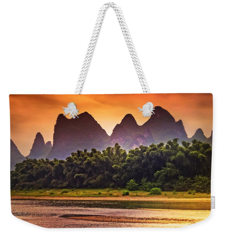 Sunset Weekender Tote Bag featuring the photograph Red sunset glows-China Guilin scenery Lijiang River in Yangshuo by Artto Pan