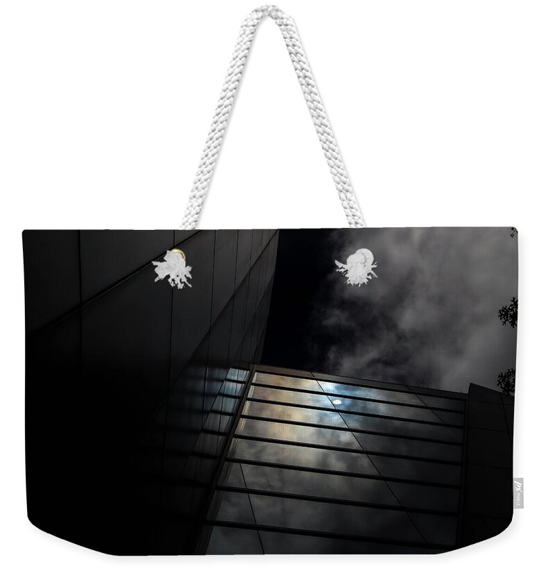 Ominous Weekender Tote Bag featuring the digital art Reflected Clouds by Kathleen Illes