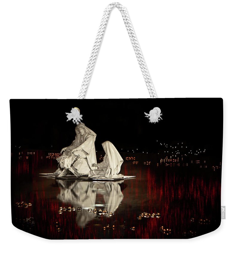 Baby; Birth; Christmas; Christmas Lights; Creche; December; Fountain; Holy; Jesus; Joseph; Mary; Nativity; Reflection; Sculpture; Temple Square; Winter; Weekender Tote Bag featuring the photograph Reflecting the Nativity by David Andersen