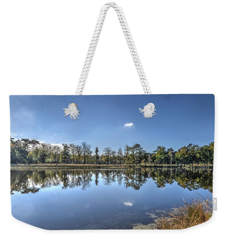 Reflection Weekender Tote Bag featuring the photograph Reflection in a Forest Lake by Frans Blok