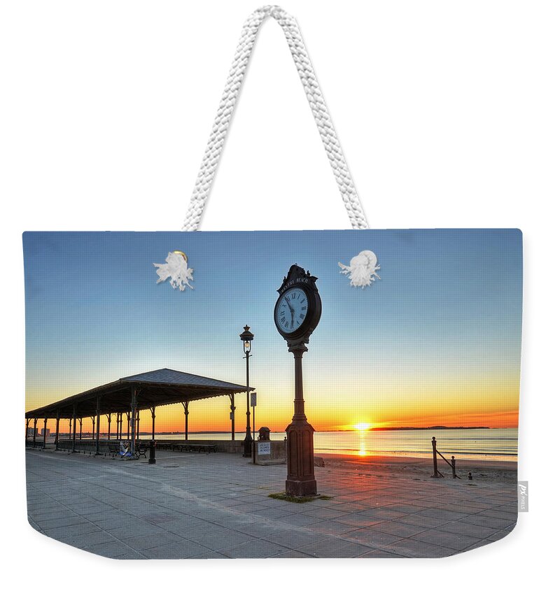 Revere Weekender Tote Bag featuring the photograph Revere Beach Clock at sunrise Revere MA by Toby McGuire