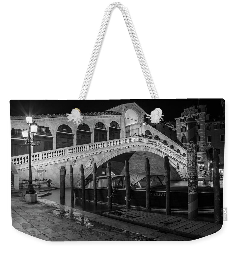 B&w Weekender Tote Bag featuring the photograph Rialto Bridge at Night with Boat by John McGraw