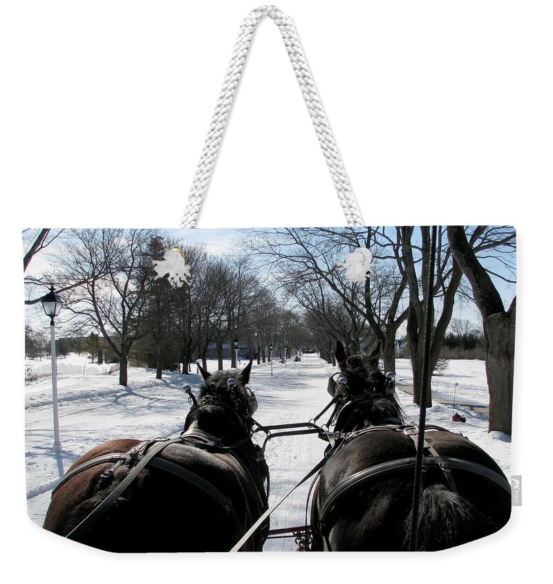 Winter Weekender Tote Bag featuring the photograph Riding into Town by Keith Stokes