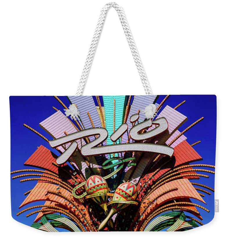 The Rio Weekender Tote Bag featuring the photograph Rio Casino Sign in the Day by Aloha Art