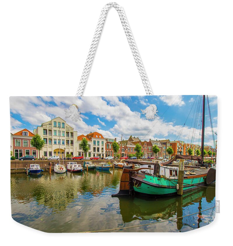 Boats Weekender Tote Bag featuring the photograph River Scene in Rotterdam by Venetia Featherstone-Witty