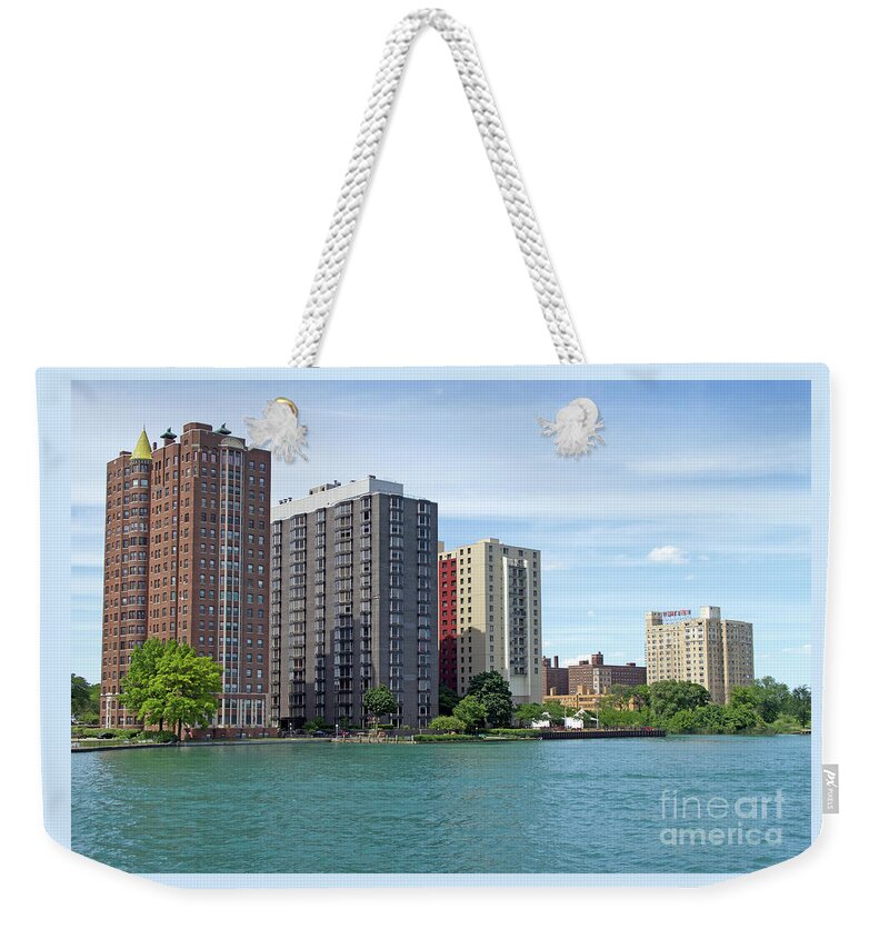 Detroit Weekender Tote Bag featuring the photograph Riverfront High-Rises by Ann Horn