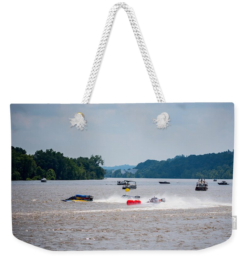 Riverfront Roar Weekender Tote Bag featuring the photograph Riverfront Roar- Taking The Turn by Holden The Moment