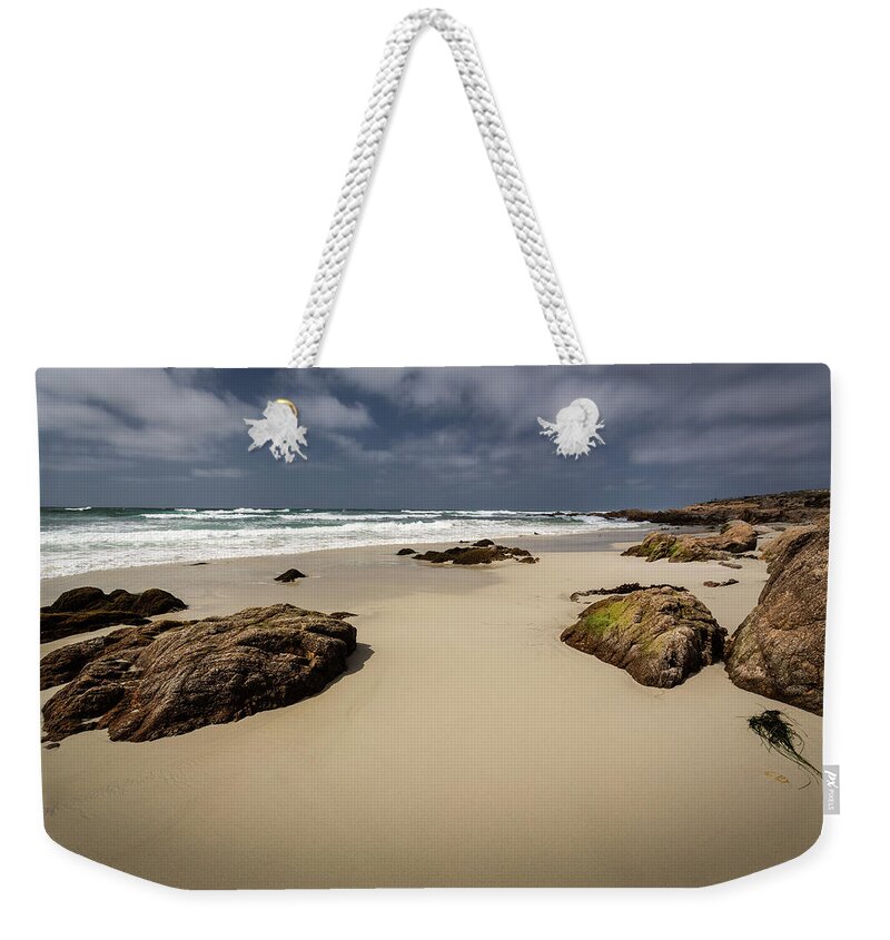 Rocks Weekender Tote Bag featuring the photograph Rocks on the Shore by Rick Strobaugh