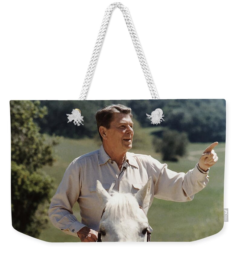 Ronald Reagan Weekender Tote Bag featuring the photograph Ronald Reagan On Horseback by War Is Hell Store
