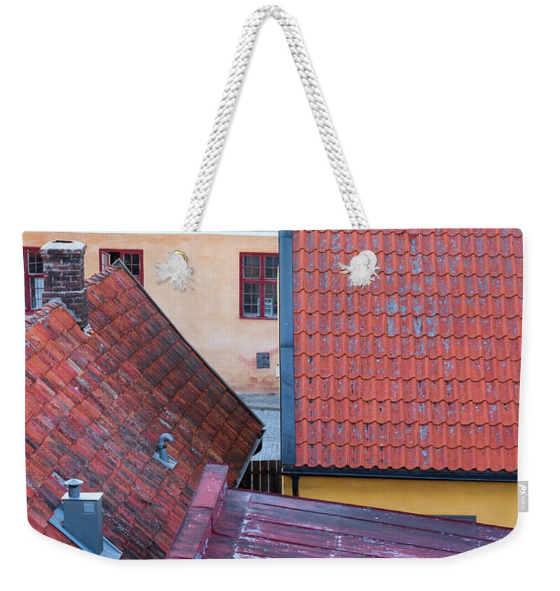 Roof Weekender Tote Bag featuring the photograph Rooftops of the Swedish town Visby by GoodMood Art