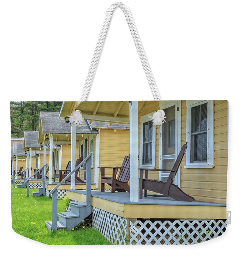 Weirs Beach Weekender Tote Bag featuring the photograph Row of vintage yellow rental cottages by Edward Fielding