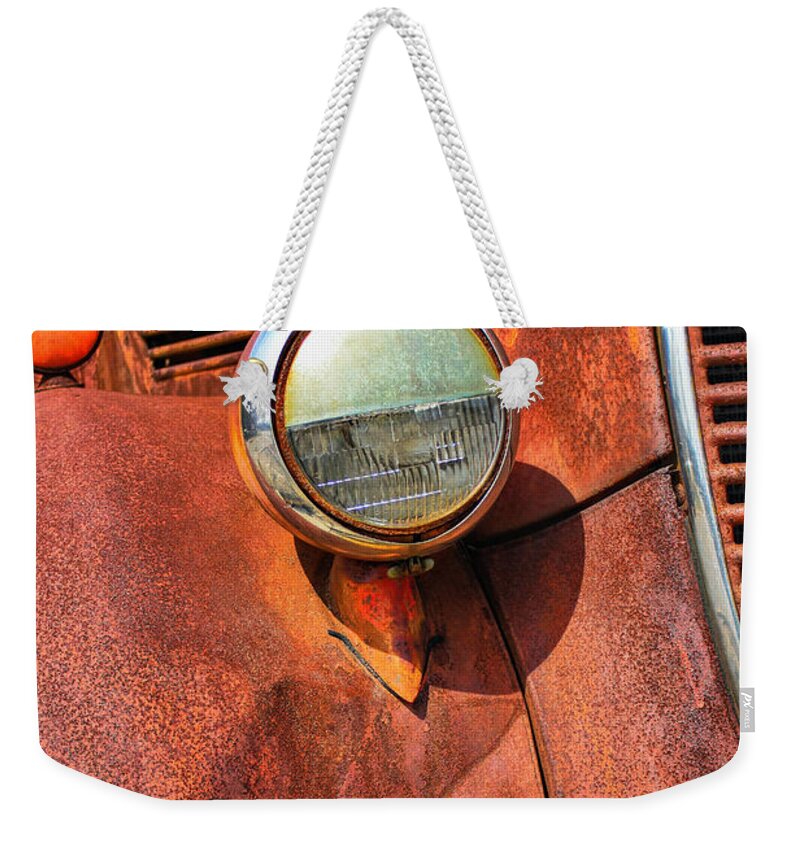 Ford Weekender Tote Bag featuring the photograph Rusty old Ford by Pat Cook