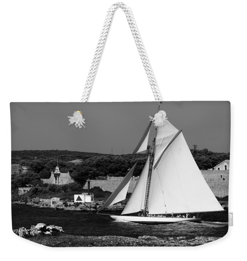 Sailboat Weekender Tote Bag featuring the photograph sailboat - a one mast classical vessel sailing in one of the most beautiful harbours Port Mahon by Pedro Cardona Llambias