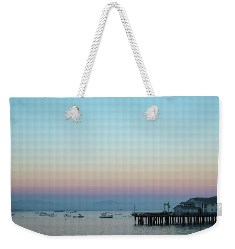 Santa Barbara Weekender Tote Bag featuring the photograph Santa Barbara pier at dusk by Andy Myatt