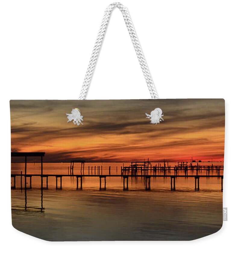15 January 2012 Weekender Tote Bag featuring the photograph Santa Rosa Sound Sunset Silhouettes Panoramic by Jeff at JSJ Photography