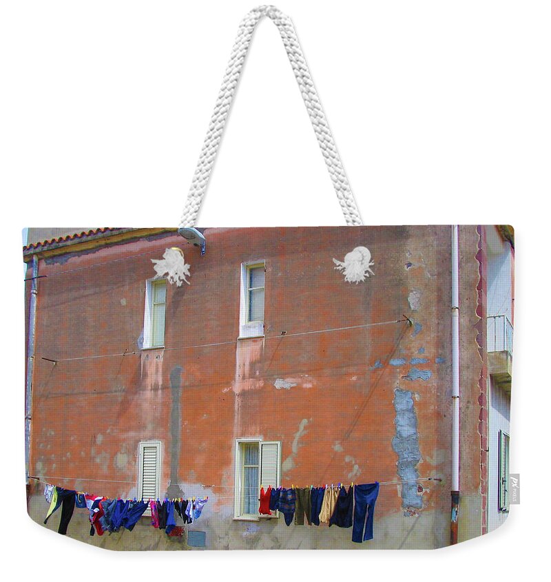 Red Building Weekender Tote Bag featuring the photograph Sardinian Laundry by Jessica Levant