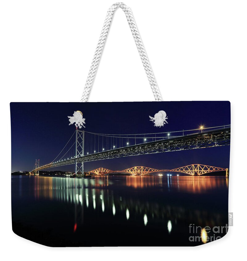 Forth Bridge Weekender Tote Bag featuring the photograph Scottish Steel in Silver and Gold lights across the Firth of Forth at Night by Maria Gaellman